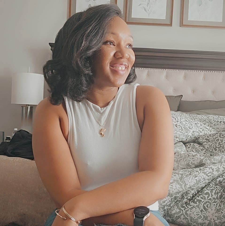 Alexis, the founder of Place & Plenty, smiling at home.